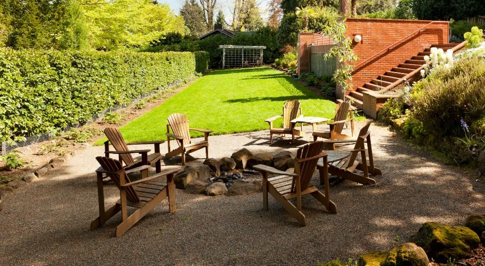 Pavers With Grass/Gravel + Fire Pit + Sofa Chairs