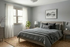 Misty gray bedroom walls with ash wood furniture creating a sophisticated small bedroom design